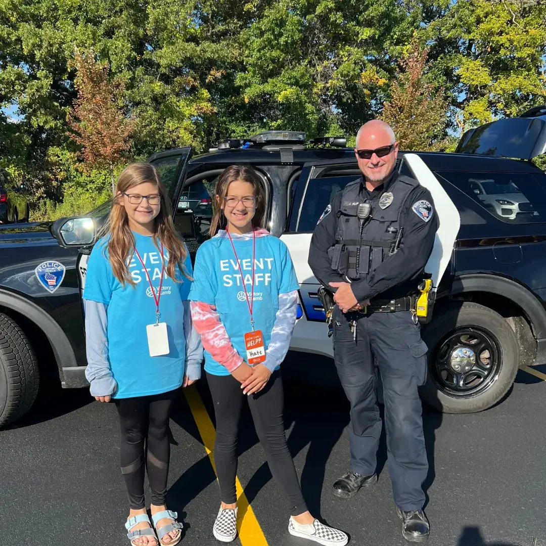 volunteers with a Franklin police officer